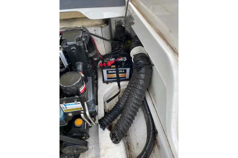 Slide: The Image of Engine compartment of 2008 Four Winns H220 boat with Duracell battery visible. - 60