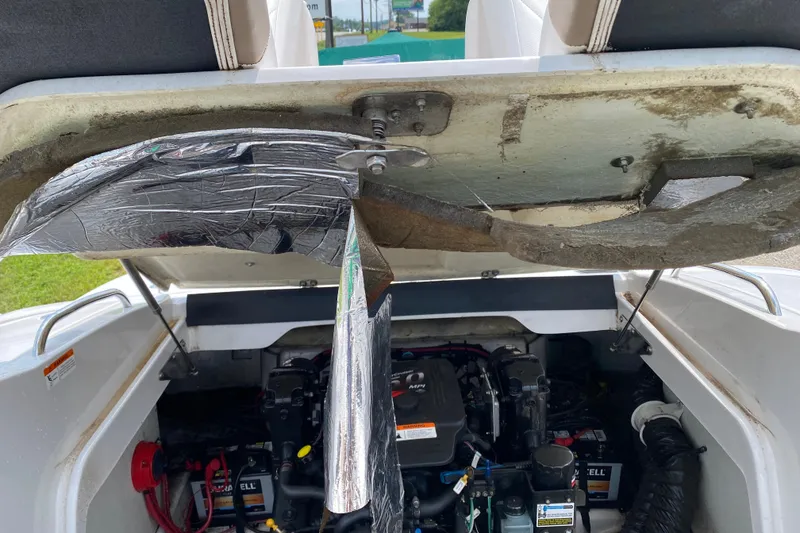 Slide: The Image of Engine compartment of a 2008 Four Winns H220 boat with exposed wiring and insulation. - 50