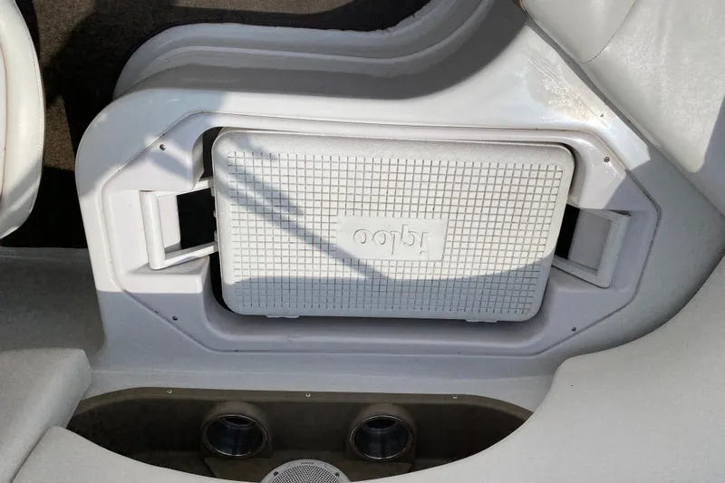 Slide: The Image of 2008 Four Winns H220 boat interior with built-in cooler storage compartment. - 39