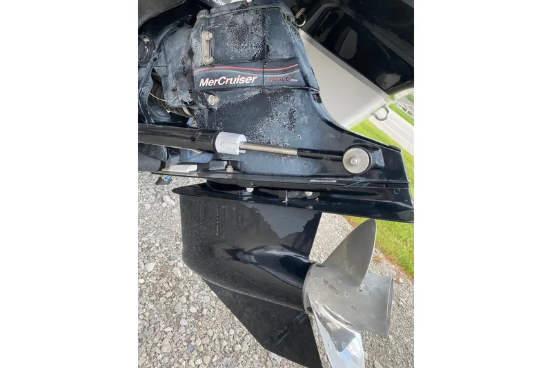 Slide: The Image of Close-up of a 2008 Four Winns H220 MerCruiser engine and propeller. - 14