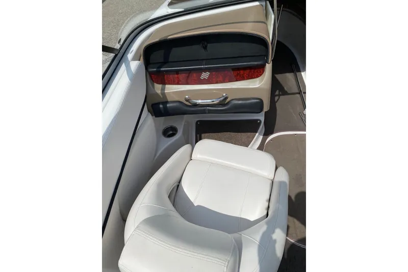 Slide: The Image of 2008 Four Winns H220 boat interior with white seating and sleek dashboard design. - 36