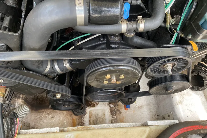 Slide: The Image of Engine components of a 2008 Four Winns H220 boat, featuring belts and pulleys. - 45