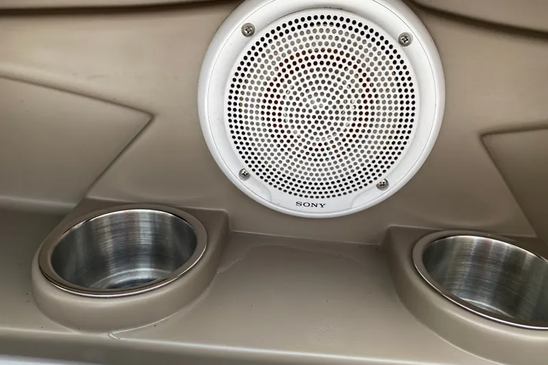 Slide: The Image of 2008 Four Winns H220 boat interior with Sony speaker and dual cup holders. - 53