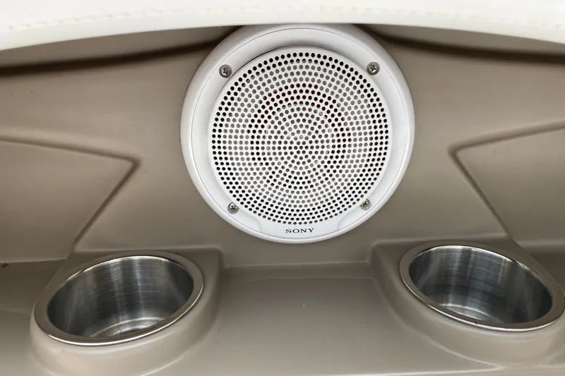 Slide: The Image of 2008 Four Winns H220 boat interior with Sony speaker and dual cup holders. - 56