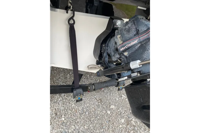 Slide: The Image of Rear view of 2008 Four Winns H220 boat with MerCruiser engine and trailer strap. - 15