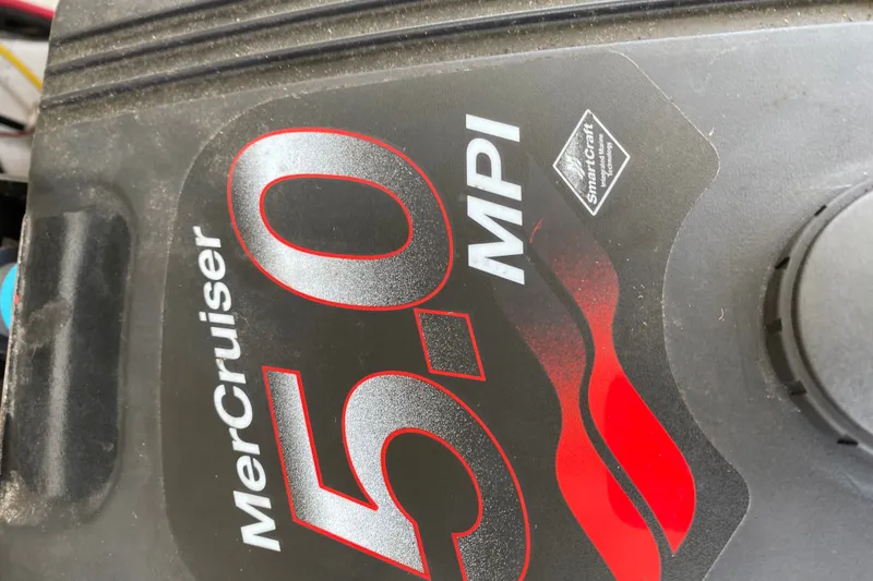 Slide: The Image of MerCruiser 5.0 MPI engine cover on a 2008 Four Winns H220 boat. - 43