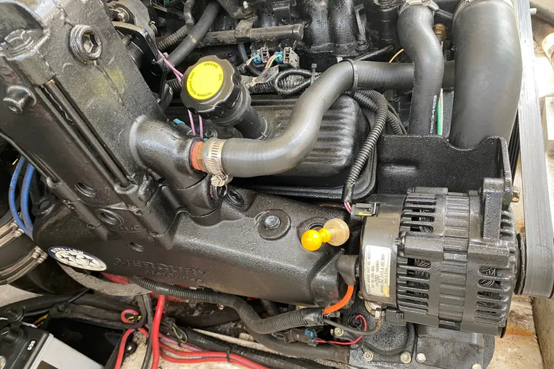 Slide: The Image of Engine compartment of a 2008 Four Winns H220 boat, showcasing detailed components. - 44