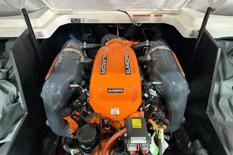 Slide: The Image of 2017 MasterCraft X46 Ilmor engine, vibrant orange, detailed view. - 15