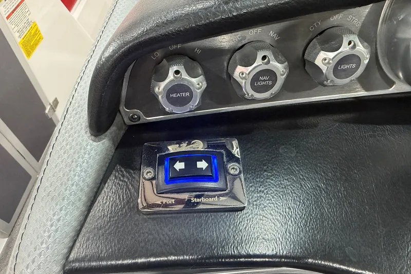 Slide: The Image of Control panel of a 2017 MasterCraft X46 boat with heater and light switches. - 13