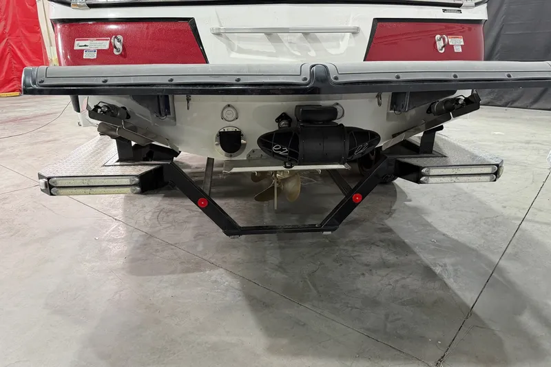 Slide: The Image of Rear view of a 2017 MasterCraft X46 boat in a garage setting. - 14