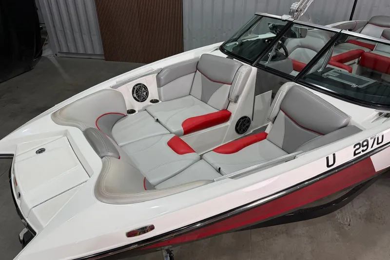 Slide: The Image of 2017 MasterCraft X46 boat interior with red and gray seating, sleek design. - 4