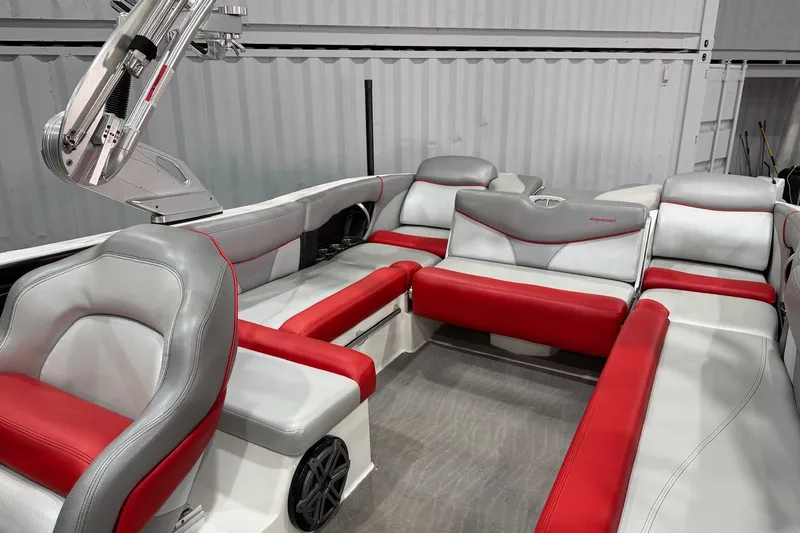 Slide: The Image of 2017 MasterCraft X46 boat interior with red and gray seating, showcasing modern design. - 11