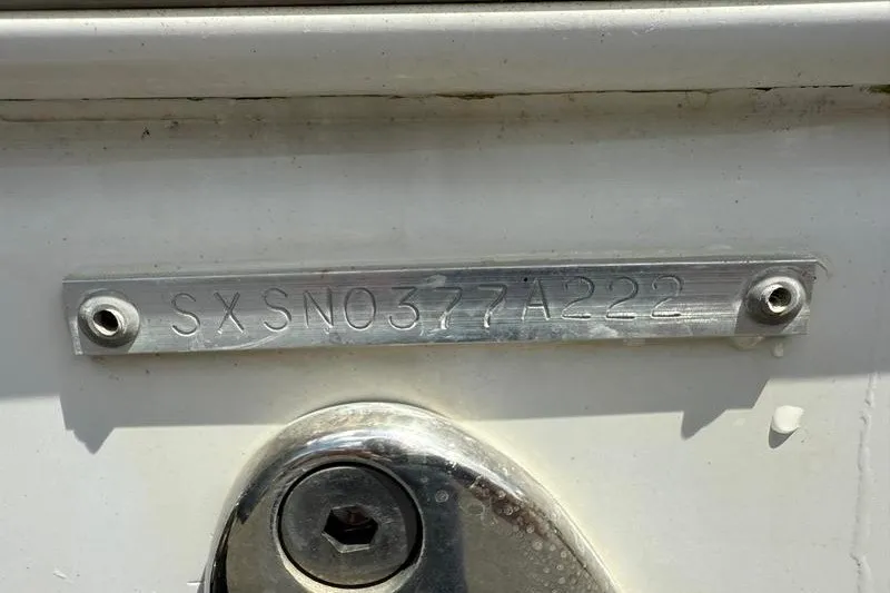 Slide: The Image of 2022 Sea Hunt Gamefish 27FS hull identification number plate. - 65