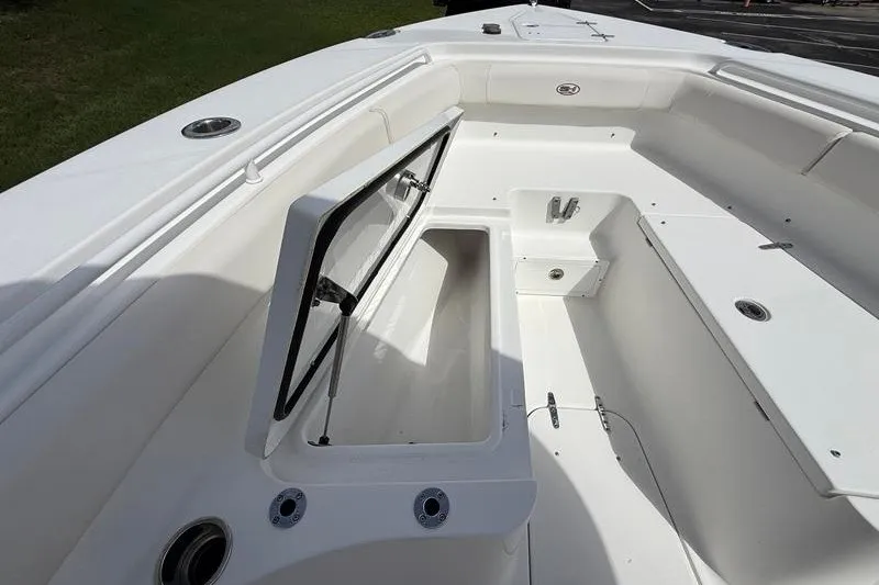 Slide: The Image of 2022 Sea Hunt Gamefish 27FS boat interior with open storage compartment. - 63