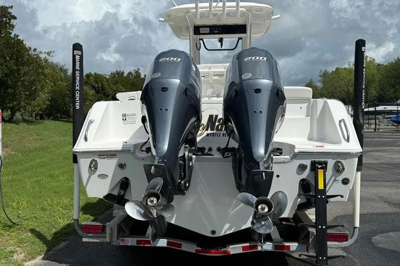 Slide: The Image of 2022 Sea Hunt Gamefish 27FS with dual 200 horsepower engines, rear view. - 32