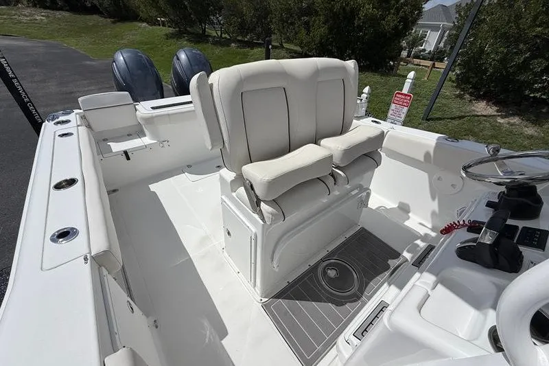 Slide: The Image of 2022 Sea Hunt Gamefish 27FS boat interior with dual helm seats and control panel. - 45