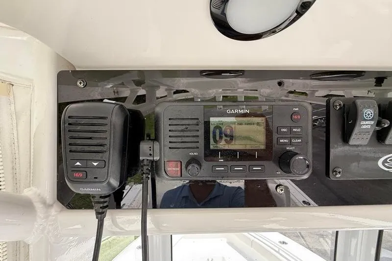 Slide: The Image of 2022 Sea Hunt Gamefish 27FS boat console with Garmin marine radio and controls. - 48