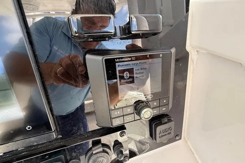 Slide: The Image of JL Audio MediaMaster 50 on 2022 Sea Hunt Gamefish 27FS boat dashboard. - 50