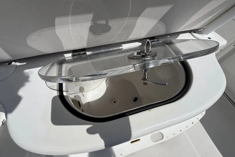 Slide: The Image of Livewell on 2022 Sea Hunt Gamefish 27FS boat, open lid showing interior. - 44