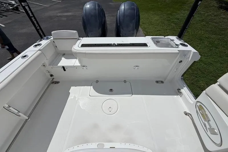 Slide: The Image of 2022 Sea Hunt Gamefish 27FS boat deck with twin engines, spacious layout. - 38