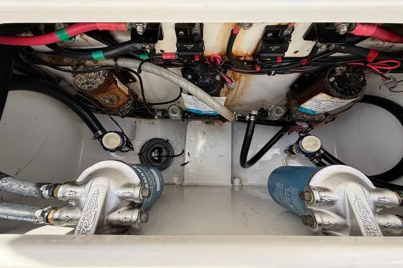 Slide: The Image of Engine compartment of 2022 Sea Hunt Gamefish 27FS with visible wiring and components. - 42