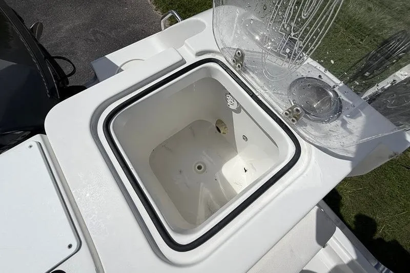 Slide: The Image of 2022 Sea Hunt Gamefish 27FS livewell with open lid, showcasing interior design. - 41