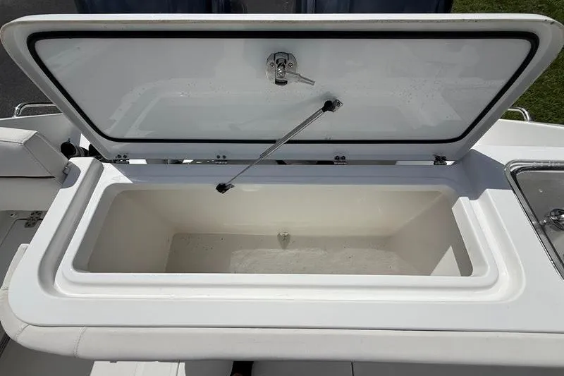 Slide: The Image of Open storage compartment on a 2022 Sea Hunt Gamefish 27FS boat. - 40