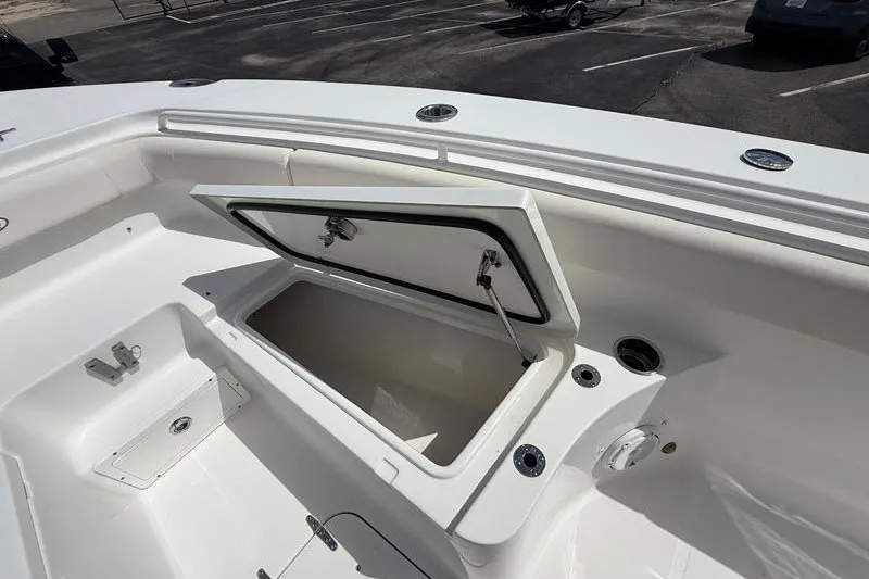 Slide: The Image of 2022 Sea Hunt Gamefish 27FS boat with open storage compartment on deck. - 62