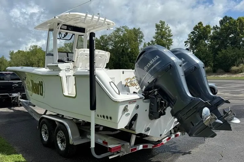 Slide: The Image of 2022 Sea Hunt Gamefish 27FS boat on trailer with dual Yamaha engines. - 33