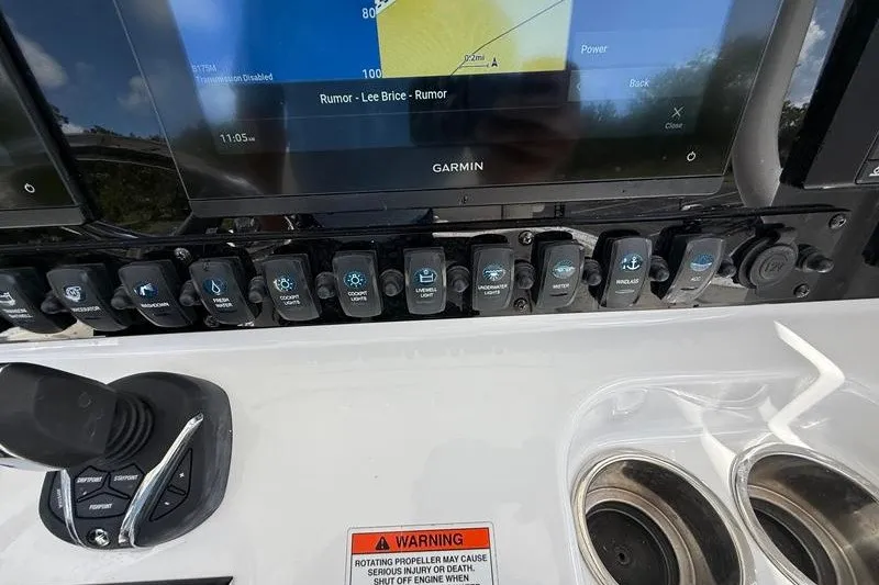 Slide: The Image of Control panel of a 2022 Sea Hunt Gamefish 27FS with Garmin navigation display. - 53