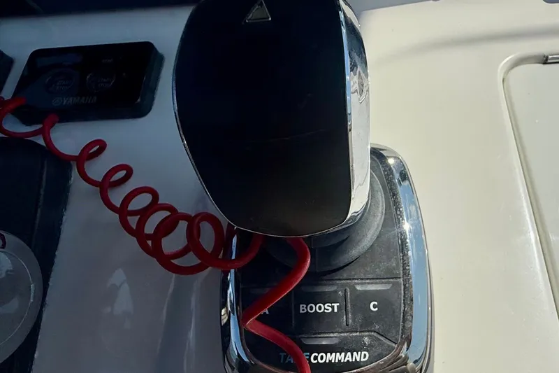 Slide: The Image of Close-up of a 2019 Tidewater 320 CC Adventure boat throttle control. - 5