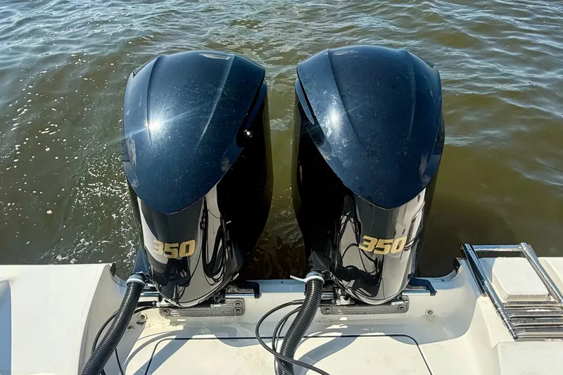Slide: The Image of Twin 350 horsepower engines on a 2019 Tidewater 320 CC Adventure boat. - 16