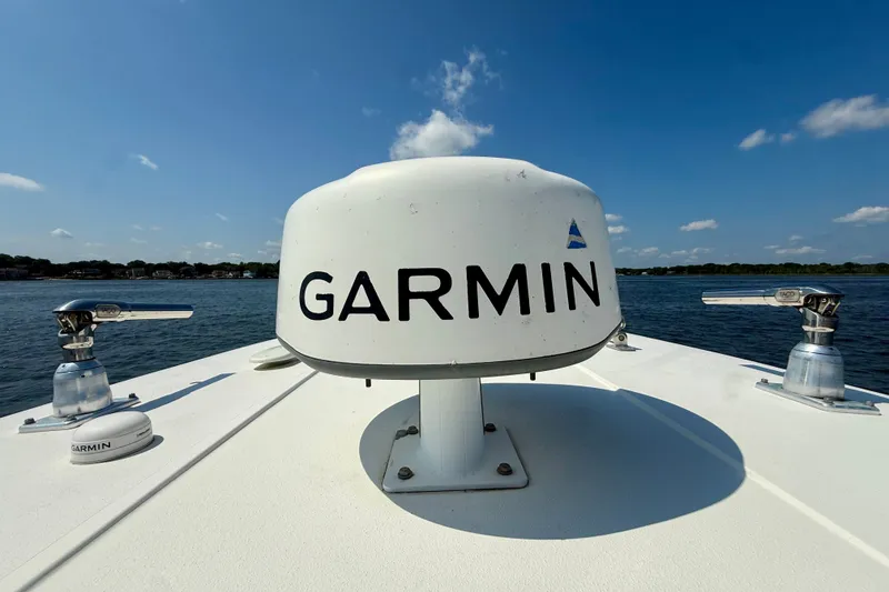 Slide: The Image of Garmin radar on 2019 Tidewater 320 CC Adventure boat, clear sky, calm water. - 25