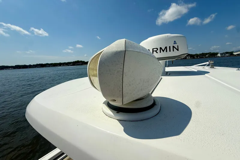 Slide: The Image of 2019 Tidewater 320 CC Adventure boat with Garmin radar on a sunny day. - 26