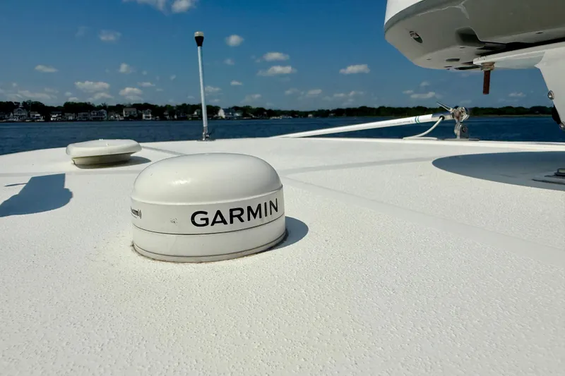 Slide: The Image of 2019 Tidewater 320 CC Adventure boat with Garmin marine equipment on deck. - 24