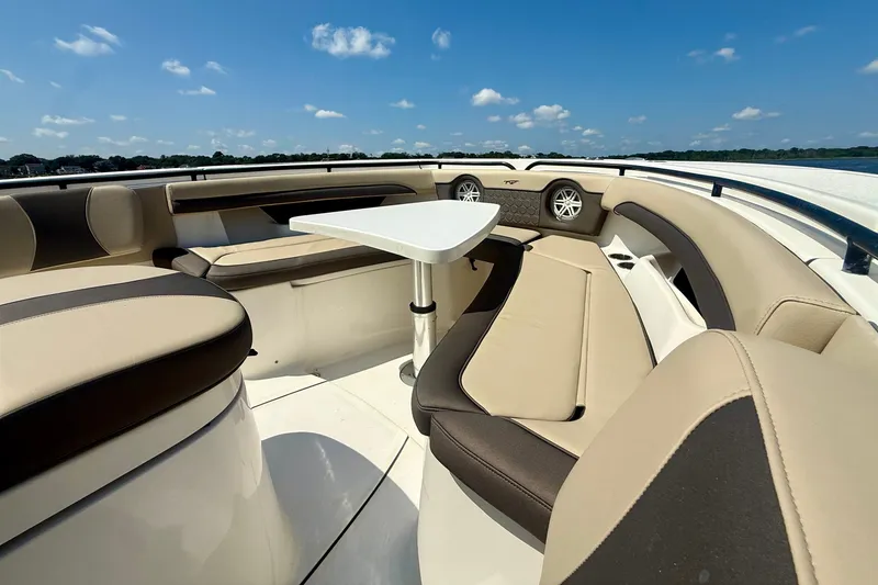 Slide: The Image of Luxurious seating area on a 2019 Tidewater 320 CC Adventure boat under a clear blue sky. - 31
