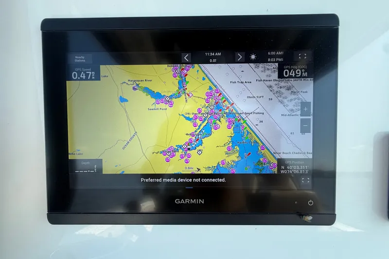 Slide: The Image of Garmin GPS display on 2019 Tidewater 320 CC Adventure boat, showing nautical map and coordinates. - 9