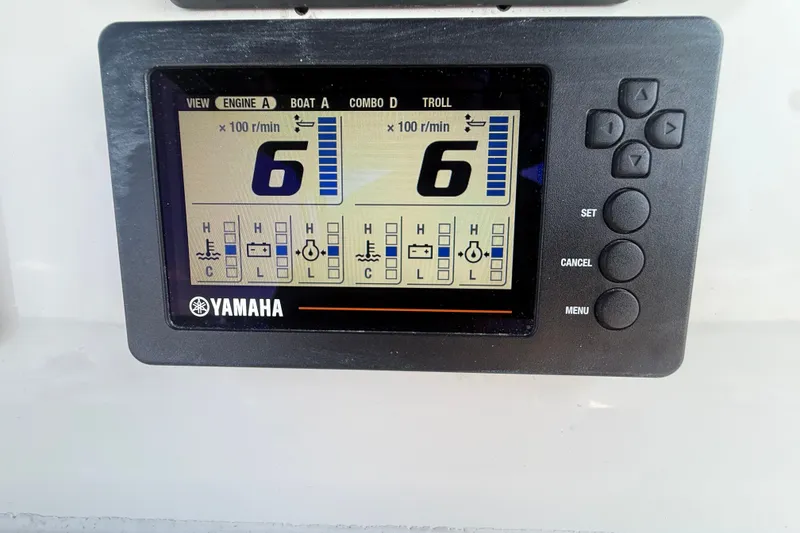 Slide: The Image of Yamaha engine display on 2019 Tidewater 320 CC Adventure boat dashboard. - 11