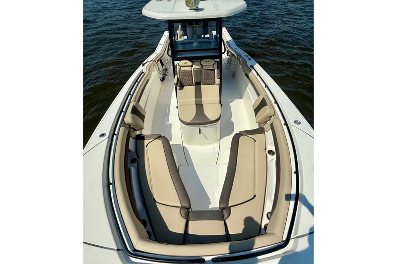 Slide: The Image of 2019 Tidewater 320 CC Adventure boat with spacious seating on calm water. - 28