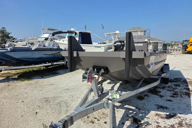 Slide: The Image of 2026 SeaArk 2072 Workhorse boat on trailer, parked outdoors in a marina setting. - 5