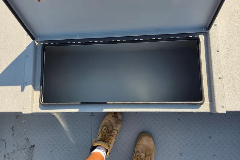 Slide: The Image of Open storage compartment on 2026 SeaArk 2072 Workhorse boat deck. - 11