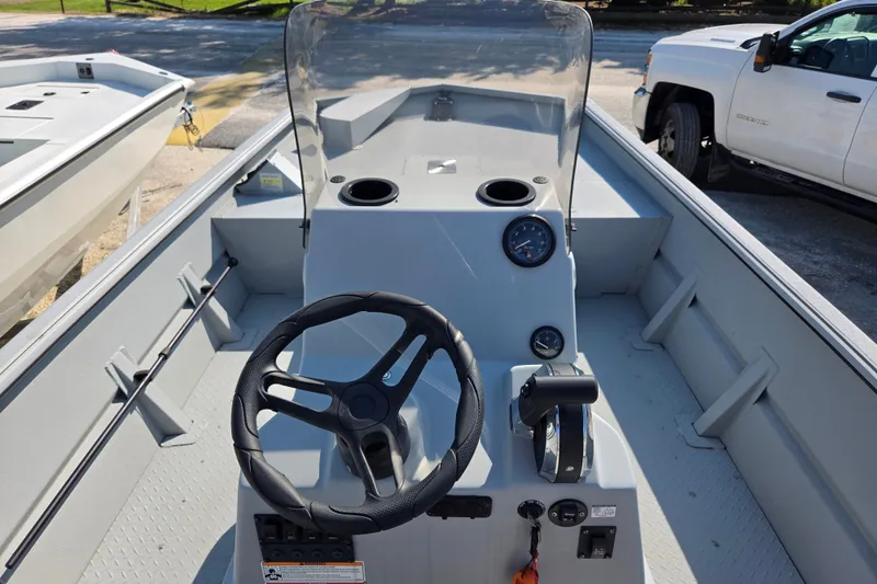 Slide: The Image of 2025 SeaArk 1872 MVT boat interior with steering wheel and control panel. - 3