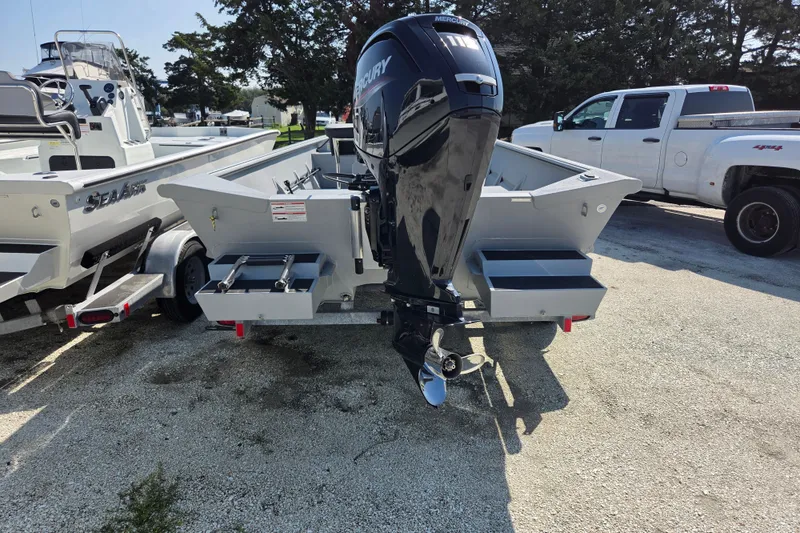 Slide: The Image of 2025 SeaArk 1872 MVT boat with Mercury outboard motor on trailer. - 6