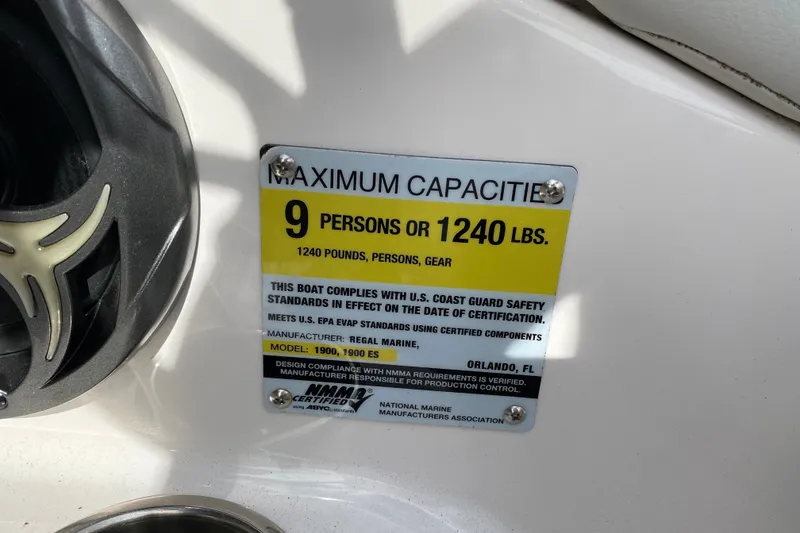 Slide: The Image of 2016 Regal 1900 ESX Bowrider capacity label: 9 persons or 1240 lbs, USCG compliant. - 28
