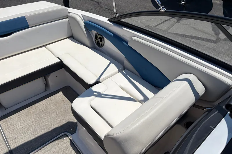 Slide: The Image of Interior seating of 2016 Regal 1900 ESX Bowrider with white and blue upholstery. - 16