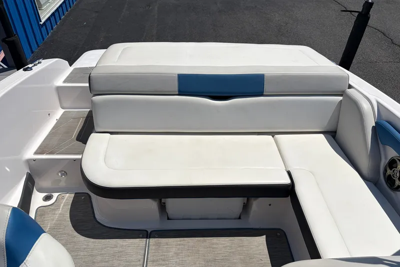 Slide: The Image of 2016 Regal 1900 ESX Bowrider interior seating with white and blue upholstery. - 18