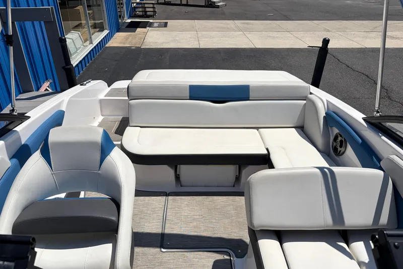 Slide: The Image of 2016 Regal 1900 ESX Bowrider interior with white and blue seating. - 17