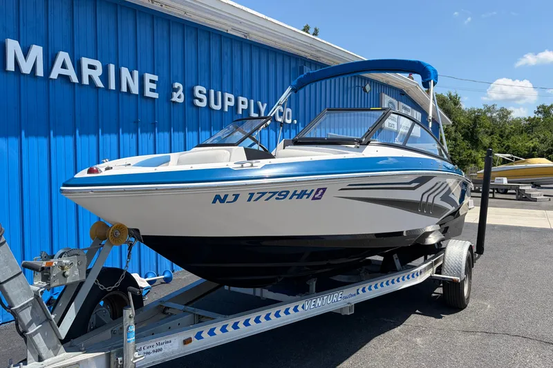 Slide: The Image of 2016 Regal 1900 ESX Bowrider on trailer at Marine Supply Co. - 7