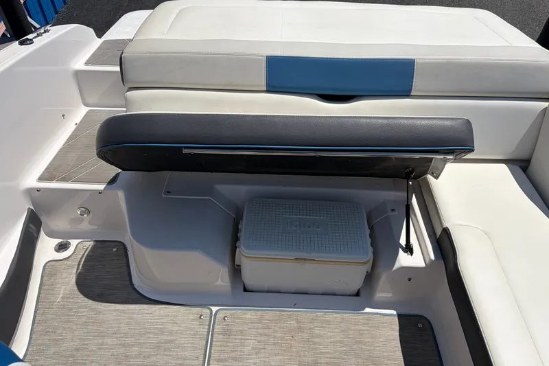 Slide: The Image of 2016 Regal 1900 ESX Bowrider interior with storage compartment and cooler. - 19