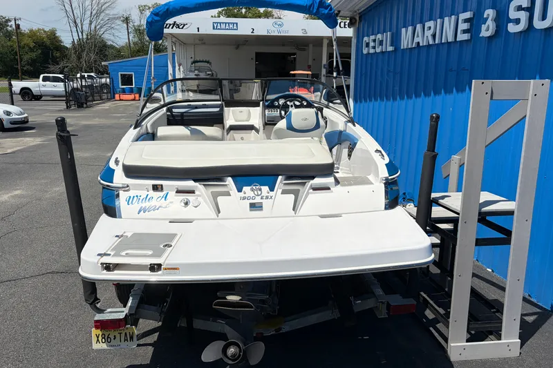 Slide: The Image of 2016 Regal 1900 ESX Bowrider boat at Cecil Marine, blue and white exterior. - 5